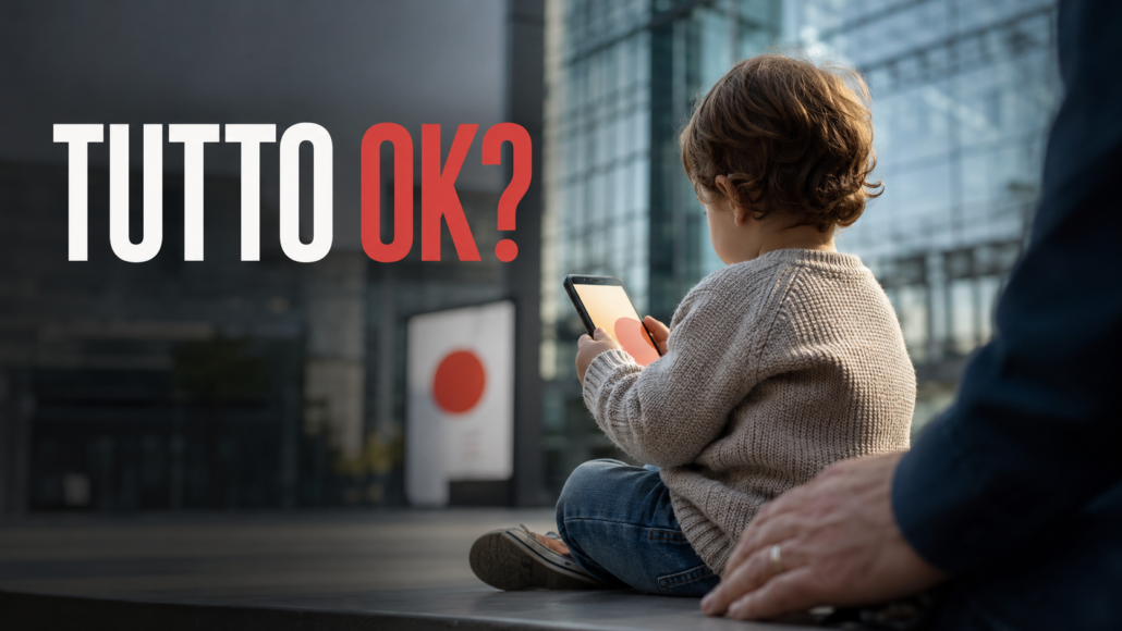 Bambino con uno smartphone accanto a un adulto, immagine editoriale sulla responsabilità educativa nell’uso della tecnologia